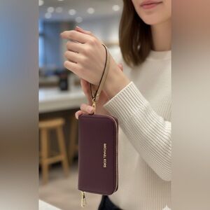 New Jet set Michael Kors Plum Zip Wristlet/wallet with Tan Strap